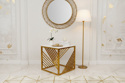 The Azure Gold Lamp Table features a modern square Polar White sintered top with a marble effect and a gold metal frame showcasing geometric diagonal side slats.